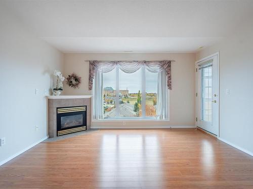 507 237 Youville Drive E, Edmonton, AB - Indoor Photo Showing Living Room With Fireplace