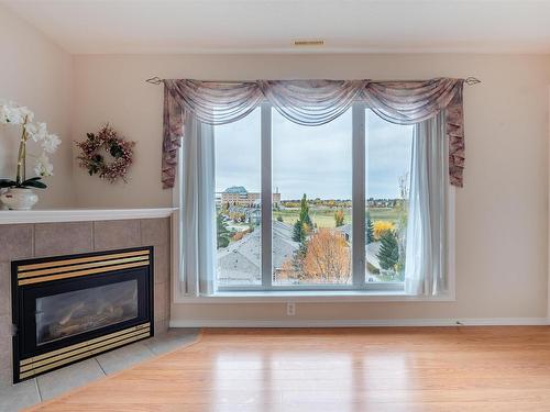 507 237 Youville Drive E, Edmonton, AB - Indoor Photo Showing Living Room With Fireplace