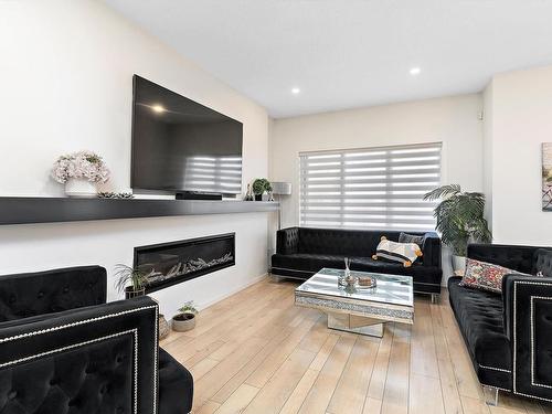 8032 174A Avenue, Edmonton, AB - Indoor Photo Showing Living Room With Fireplace