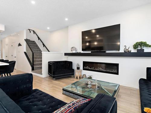 8032 174A Avenue, Edmonton, AB - Indoor Photo Showing Living Room With Fireplace