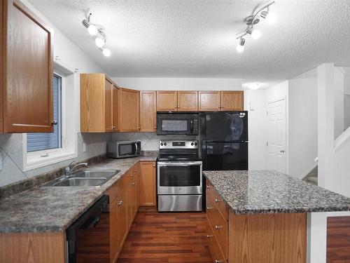 16 120 Magrath Road, Edmonton, AB - Indoor Photo Showing Kitchen With Double Sink