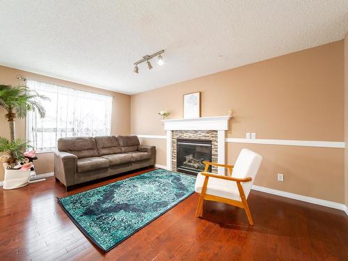 13035 35 Street, Edmonton, AB - Indoor Photo Showing Living Room With Fireplace