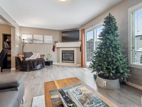 80 Meadowland Crescent, Spruce Grove, AB - Indoor Photo Showing Living Room With Fireplace