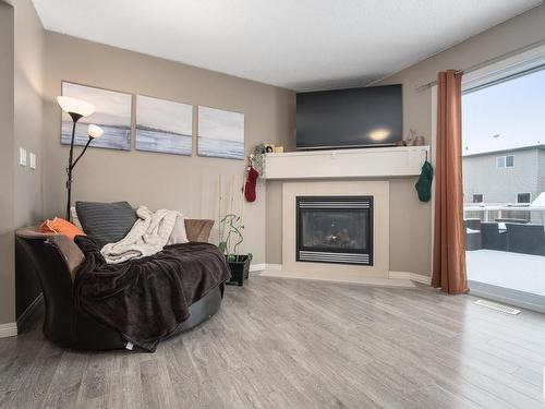 80 Meadowland Crescent, Spruce Grove, AB - Indoor Photo Showing Living Room With Fireplace