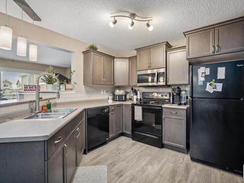 80 Meadowland Crescent, Spruce Grove, AB - Indoor Photo Showing Kitchen With Double Sink