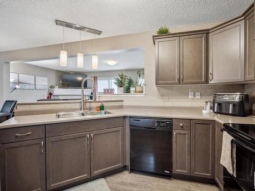 80 Meadowland Crescent, Spruce Grove, AB - Indoor Photo Showing Kitchen With Double Sink