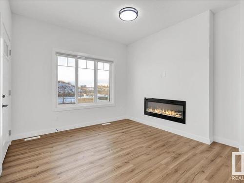 16546 21 Avenue, Edmonton, AB - Indoor Photo Showing Living Room With Fireplace