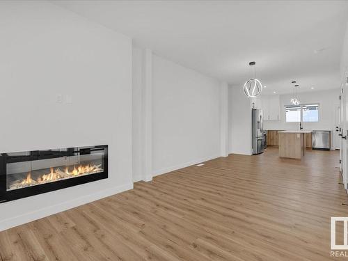 16546 21 Avenue, Edmonton, AB - Indoor Photo Showing Living Room With Fireplace