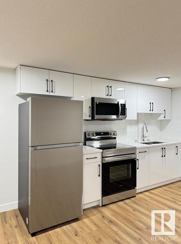 16546 21 Avenue, Edmonton, AB - Indoor Photo Showing Kitchen With Stainless Steel Kitchen