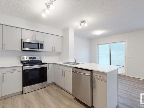 1733 Westerra Wynd, Stony Plain, AB - Indoor Photo Showing Kitchen With Stainless Steel Kitchen With Double Sink