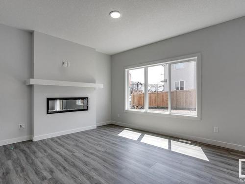 1205 16A Avenue, Edmonton, AB - Indoor Photo Showing Living Room With Fireplace