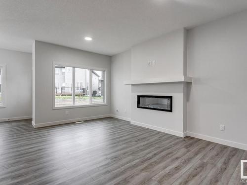 1237 16A Avenue, Edmonton, AB - Indoor Photo Showing Living Room With Fireplace