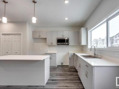 1643 16 Avenue, Edmonton, AB - Indoor Photo Showing Kitchen With Double Sink