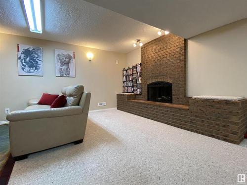 6928 21 Avenue, Edmonton, AB - Indoor Photo Showing Living Room With Fireplace