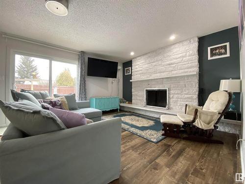 6928 21 Avenue, Edmonton, AB - Indoor Photo Showing Living Room With Fireplace