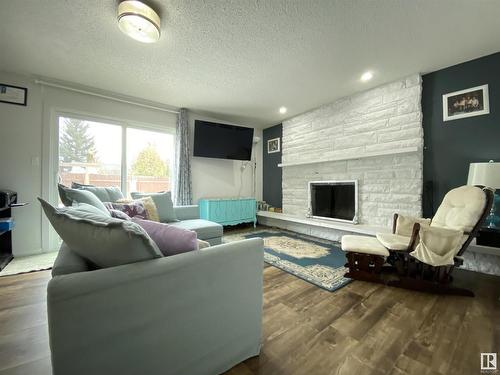 6928 21 Avenue, Edmonton, AB - Indoor Photo Showing Living Room With Fireplace