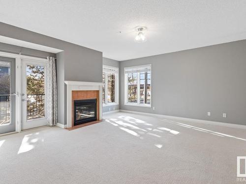 201 9803 96A Street, Edmonton, AB - Indoor Photo Showing Other Room With Fireplace