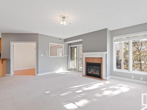 201 9803 96A Street, Edmonton, AB - Indoor Photo Showing Living Room With Fireplace