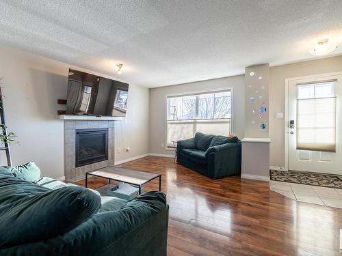 6822 21A Avenue, Edmonton, AB - Indoor Photo Showing Living Room With Fireplace