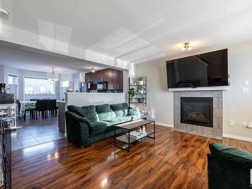 6822 21A Avenue, Edmonton, AB - Indoor Photo Showing Living Room With Fireplace