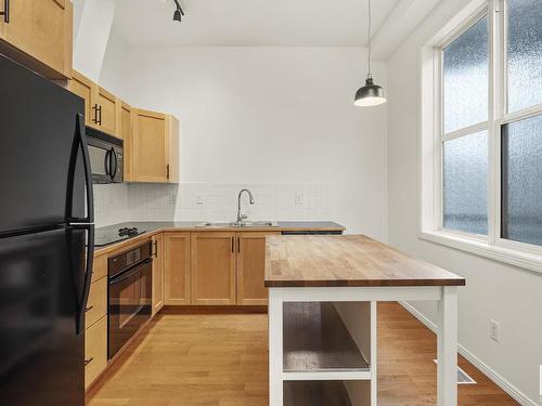 422 10407 122 Street, Edmonton, AB - Indoor Photo Showing Kitchen With Double Sink