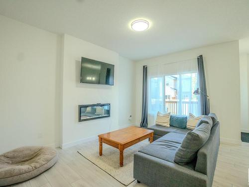 25 Meadowbrook Way, Spruce Grove, AB - Indoor Photo Showing Living Room With Fireplace