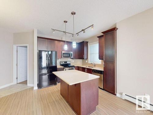 413 2590 Anderson Way, Edmonton, AB - Indoor Photo Showing Kitchen With Double Sink