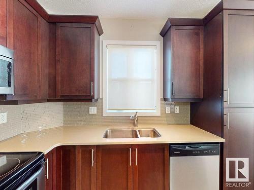 413 2590 Anderson Way, Edmonton, AB - Indoor Photo Showing Kitchen With Double Sink