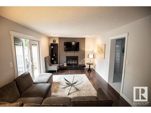 615 Wahstao Road, Edmonton, AB - Indoor Photo Showing Living Room With Fireplace