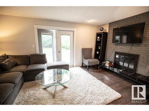 615 Wahstao Road, Edmonton, AB - Indoor Photo Showing Living Room With Fireplace