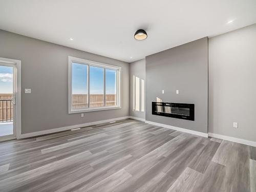 3724 67 Street, Beaumont, AB - Indoor Photo Showing Living Room With Fireplace