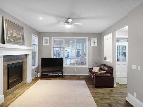 8404 24 Avenue Sw, Edmonton, AB - Indoor Photo Showing Living Room With Fireplace