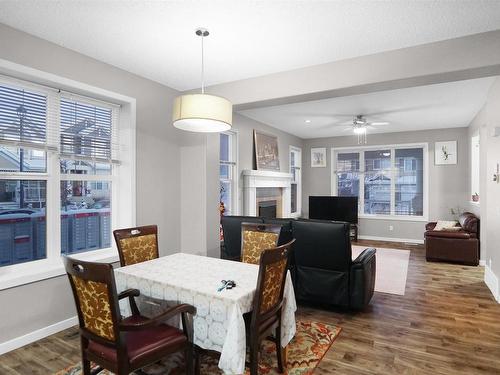 8404 24 Avenue Sw, Edmonton, AB - Indoor Photo Showing Dining Room With Fireplace