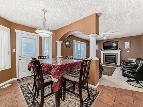 6344 166 Avenue, Edmonton, AB - Indoor Photo Showing Dining Room With Fireplace