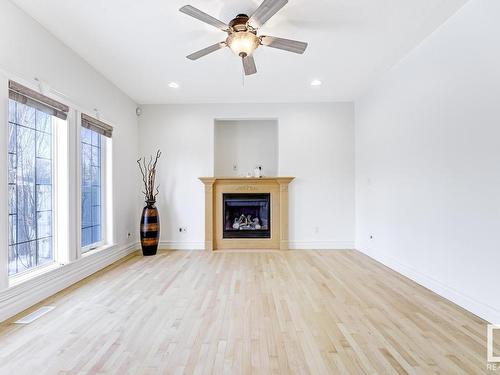 3020 Macneil Way, Edmonton, AB - Indoor Photo Showing Living Room With Fireplace