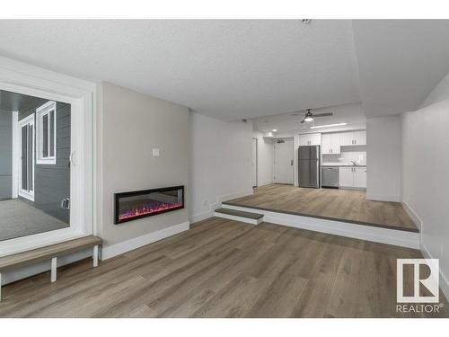 208 9504 182 Street, Edmonton, AB - Indoor With Fireplace