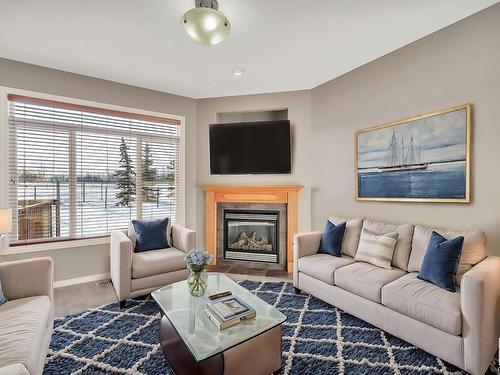 104 Westerra Boulevard, Stony Plain, AB - Indoor Photo Showing Living Room With Fireplace