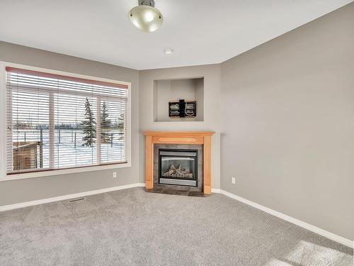 104 Westerra Boulevard, Stony Plain, AB - Indoor Photo Showing Living Room With Fireplace