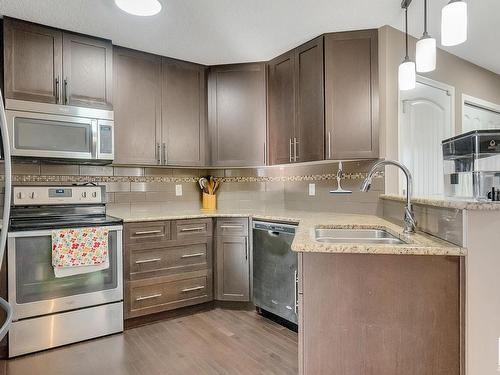 7193 Cardinal Way, Edmonton, AB - Indoor Photo Showing Kitchen With Stainless Steel Kitchen With Double Sink With Upgraded Kitchen