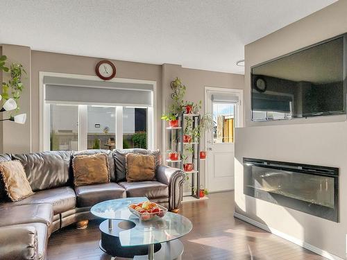 7193 Cardinal Way, Edmonton, AB - Indoor Photo Showing Living Room With Fireplace