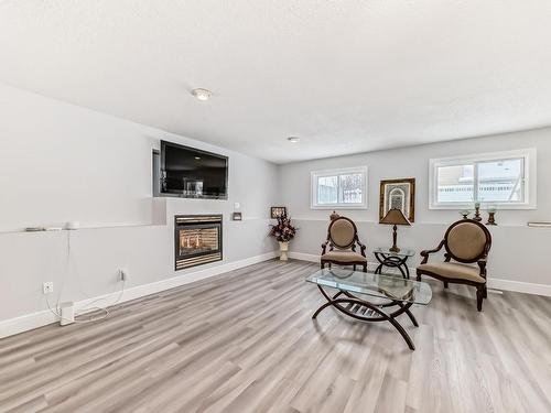 10735 Beaumaris Road, Edmonton, AB - Indoor Photo Showing Living Room With Fireplace