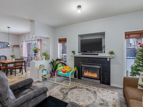 37 Birchmont Crescent, Leduc, AB - Indoor Photo Showing Living Room With Fireplace