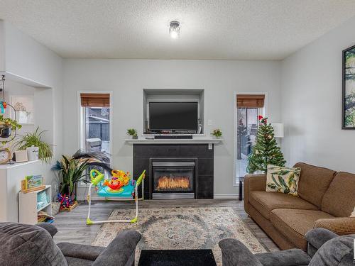 37 Birchmont Crescent, Leduc, AB - Indoor Photo Showing Living Room With Fireplace