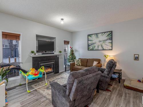 37 Birchmont Crescent, Leduc, AB - Indoor Photo Showing Living Room With Fireplace