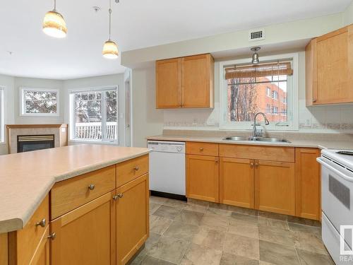 210 8909 100 Street, Edmonton, AB - Indoor Photo Showing Kitchen With Double Sink