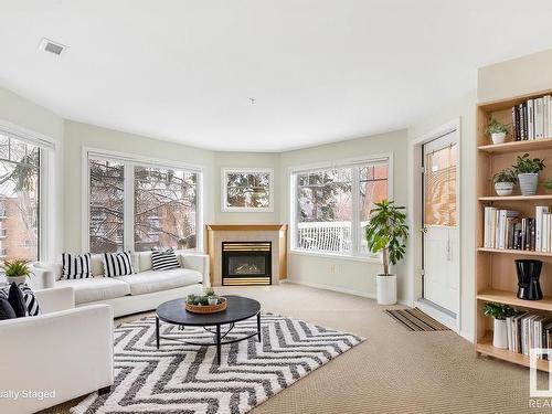 210 8909 100 Street, Edmonton, AB - Indoor Photo Showing Living Room With Fireplace