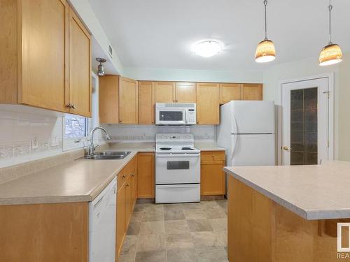 210 8909 100 Street, Edmonton, AB - Indoor Photo Showing Kitchen With Double Sink