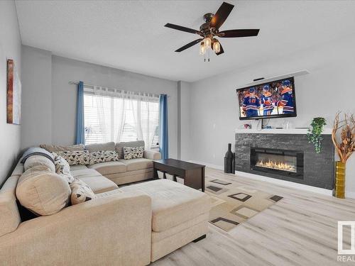 285 Ameena Drive, Leduc, AB - Indoor Photo Showing Living Room With Fireplace