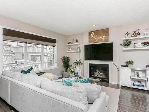 16023 10 Avenue, Edmonton, AB - Indoor Photo Showing Living Room With Fireplace