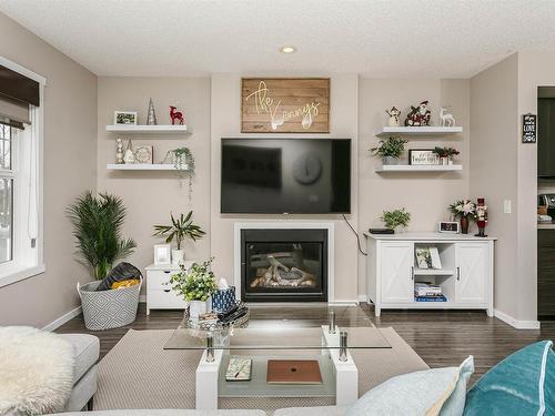 16023 10 Avenue, Edmonton, AB - Indoor Photo Showing Living Room With Fireplace